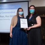 Roz Gittins receiving award certificate from CMHP President